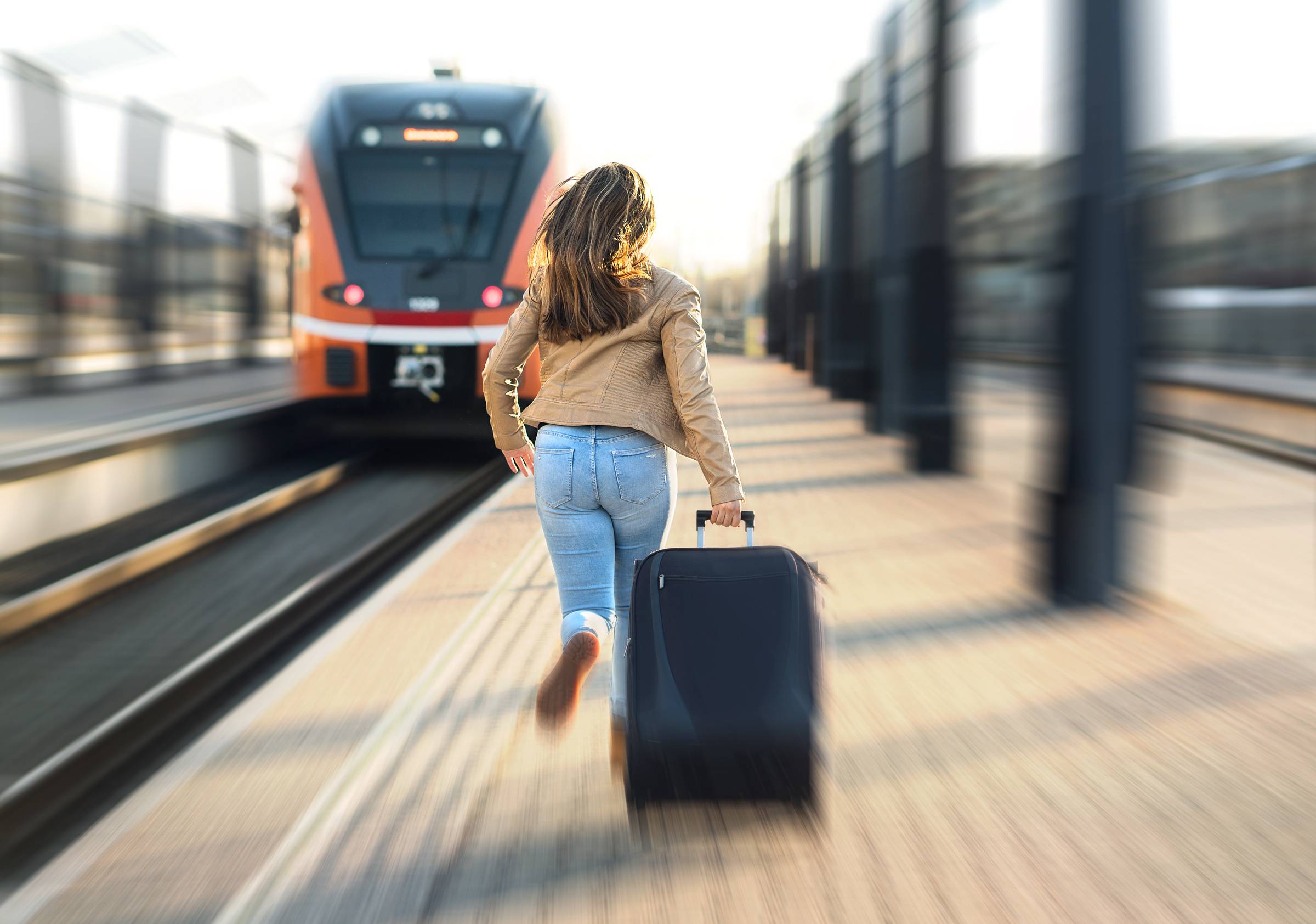 woman running toward train because of communication and travel issues during mercury retrograde